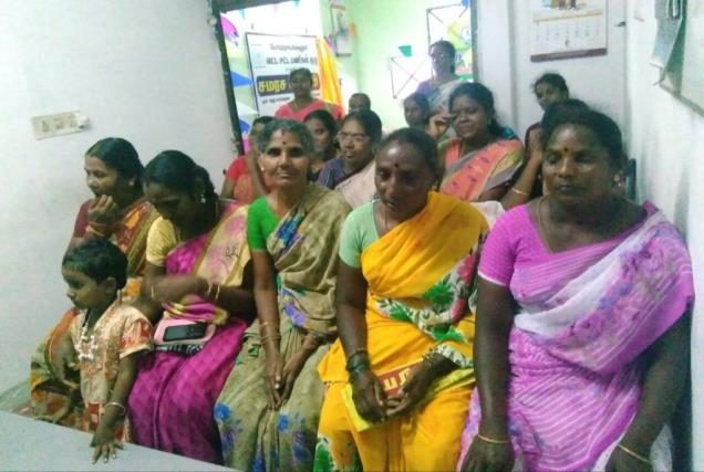 SHG members in cultural attire at a village event