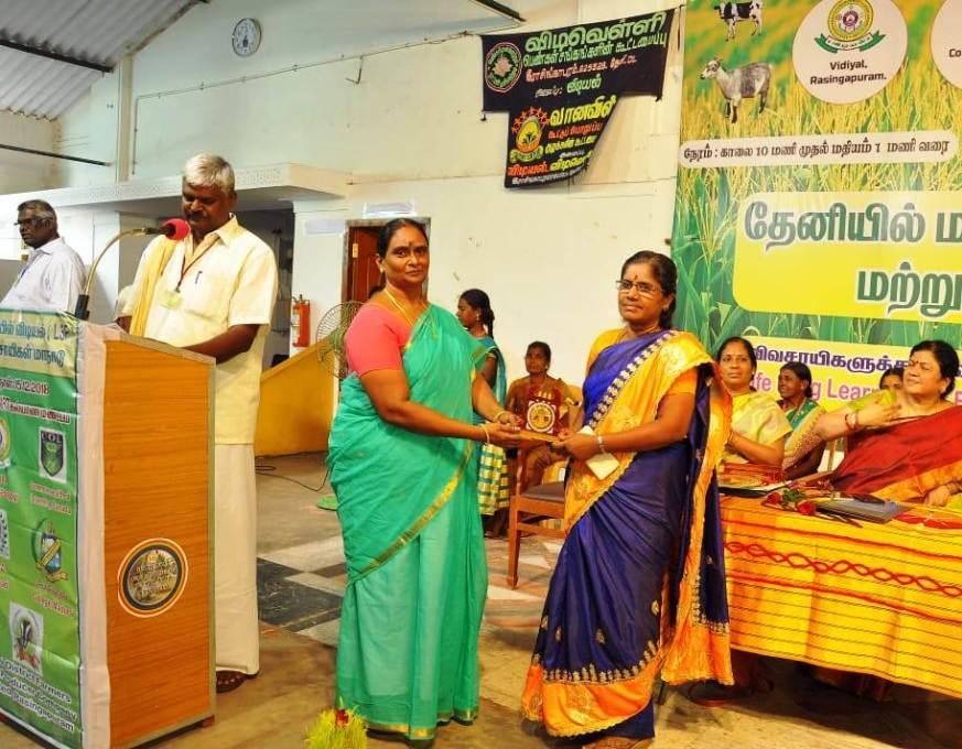 Women and community members of SMS at a village program in Theni District